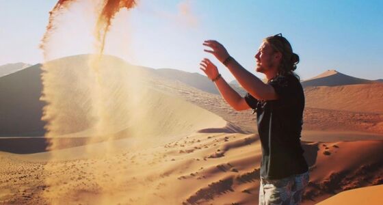 man on sand dune