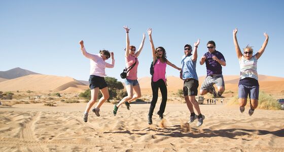 people jumping on dune